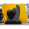 Angel carving black headstone